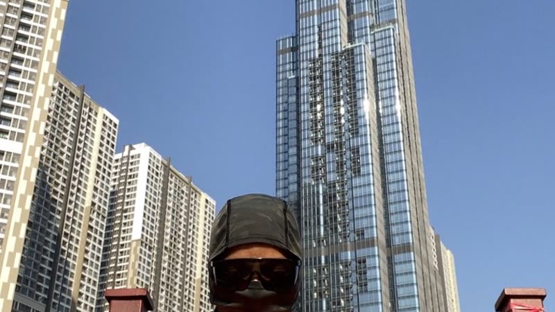 Poster still from the OYOTTA tower ascent performance film.